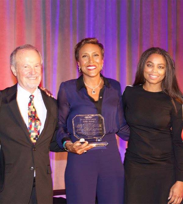 Robin Roberts poses with two fellow honorees and her award at the gala